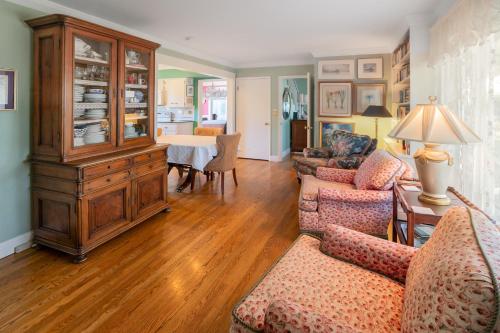 a living room with two couches and a wooden cabinet at Highland Park House in Walla Walla