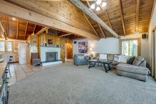 a living room with a couch and a fireplace at Delton Oasis Retreat with Lake Views and Deck! in Delton