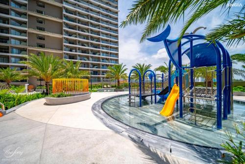a playground at a resort with a slide at The Song Apartment-Thom in Vung Tau