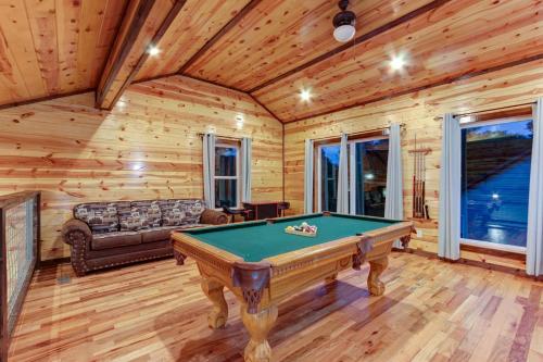 a room with a pool table in a cabin at 3 Master Bedrooms - Sleeps 10 - Location - Game Room - Hot Tub in Pigeon Forge