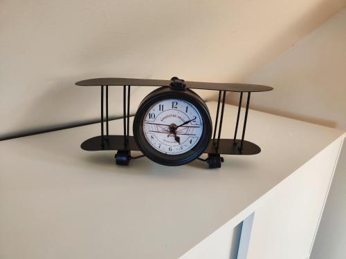a clock sitting on top of a wall at Holiday house Panorama in Ozalj