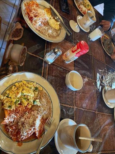 a table with plates of food on top of it at Cabañas De Lolita En Barrancas del cobre in Areponapuchi