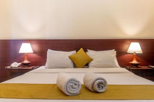 Postel nebo postele na pokoji v ubytování Segara Agung Boutique Hotel