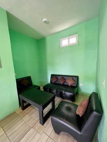 a living room with a couch and a table at Hotel Pazifico en Monterrico in Monterrico