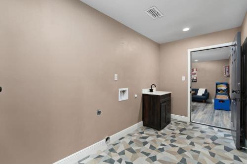 a room with a hallway with a mirror and a door at The Sinatra - Fun 5BD Home Huge Pool Game Room in Round Rock
