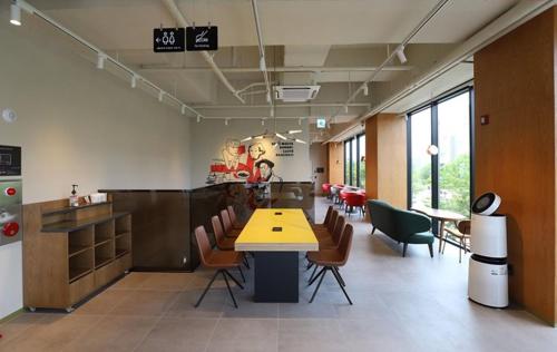 a large room with a table and chairs in it at Hotel Grand Bay Boryeong in Boryeong