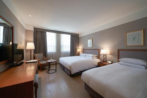 Postel nebo postele na pokoji v ubytování Mayfield Hotel Seoul