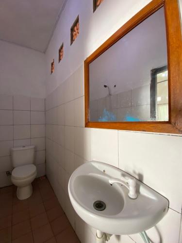 a bathroom with a sink and a toilet at Salt Life Gili Trawangan in Gili Trawangan