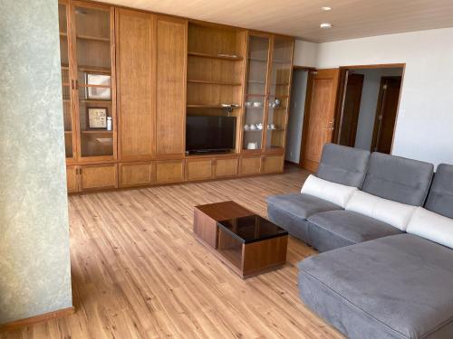a living room with a couch and a coffee table at Support Inn Minami-Chita Annex Hamachaya in Minamichita