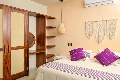 Ένα ή περισσότερα κρεβάτια σε δωμάτιο στο The Sunset Villas