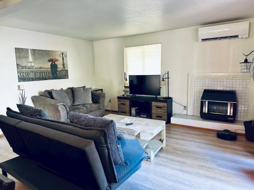 a living room with a couch and a coffee table at Meritage in Corvallis