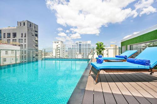 a swimming pool on top of a building at Yuni Hotel And Apartment in Da Nang