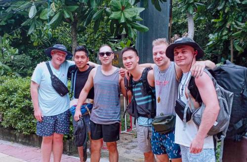 a group of young men posing for a picture at Sweed Dee Hostel in Phi Phi Don