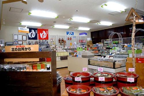 a store filled with lots of food on display at Sapporo's Secret Onsen Sanctuary Marukoma Onsen Ryokan in Chitose