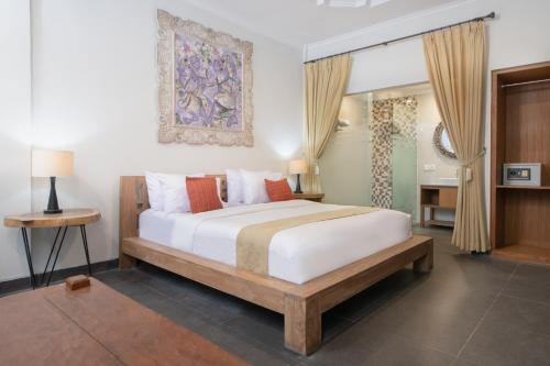 Ένα ή περισσότερα κρεβάτια σε δωμάτιο στο Villa Bunga Hotel