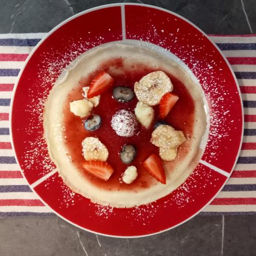 a red bowl of soup with fruit and berries at SANTINO'S HOUSE in Peveragno