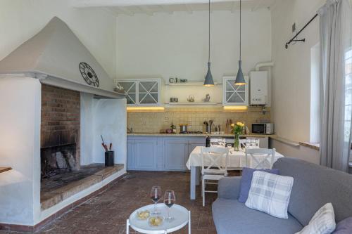 a living room with a couch and a fireplace at Agriturismo Spazzavento in Palazzone