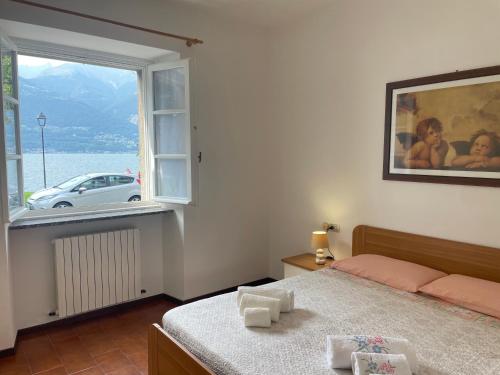Katil atau katil-katil dalam bilik di Colico - Vista lago charme - Affitti Brevi Italia