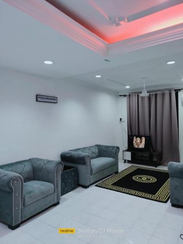 Гостиная зона в NAURAH HOMESTAY