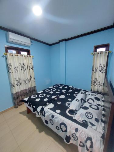 Postel nebo postele na pokoji v ubytování D'Ru Guest House
