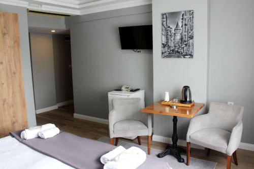 Postel nebo postele na pokoji v ubytování biglife hotel