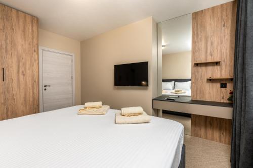 Ένα ή περισσότερα κρεβάτια σε δωμάτιο στο City apartments-3