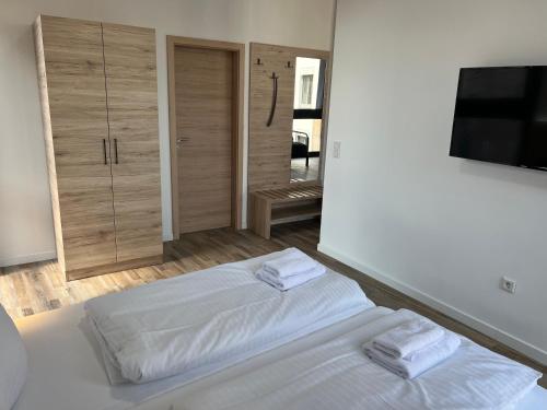 Postel nebo postele na pokoji v ubytování NB Apartments