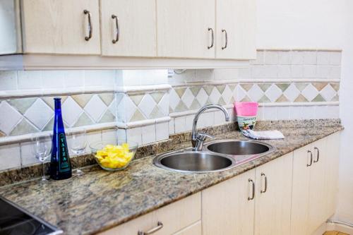 a kitchen counter top with two sinks in a kitchen at Penthouse Ocean View Puerto del Carmen in Puerto del Carmen