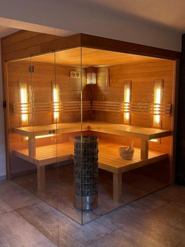 a large wooden room with a glass wall at Chalet Martuška - Drevenica so saunou - Celá dolina len pre vás in Levoča