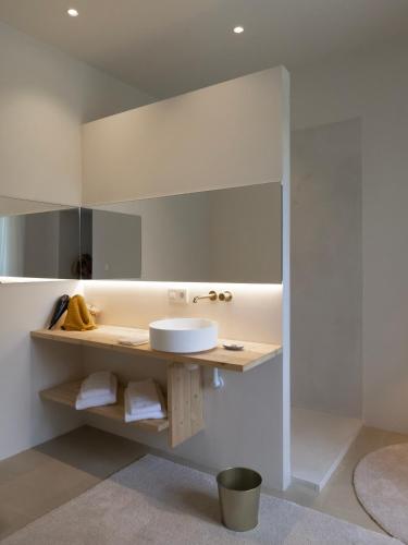 a bathroom with a sink and a mirror at Château du Pont d'Oye in Habay-la-Neuve