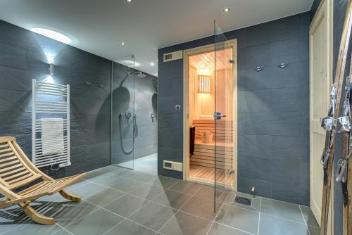 a bathroom with a shower and a glass shower stall at Chalet Caleris in Chamonix