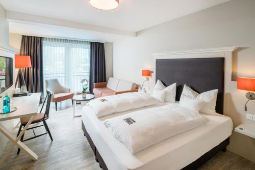 Postel nebo postele na pokoji v ubytování Flair Hotel Rieckmann