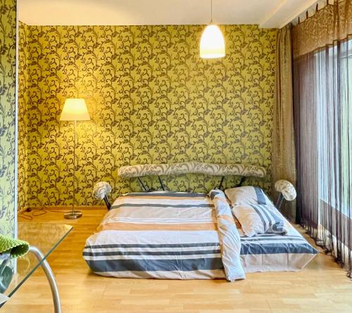 เตียงในห้องที่ Poilsis Palangoje Su Terasa - 10 Min iki Jūros ir SPA