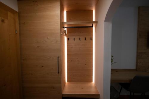 a room with a wooden door with lights on it at Sporthotel Dachstein West in Annaberg im Lammertal