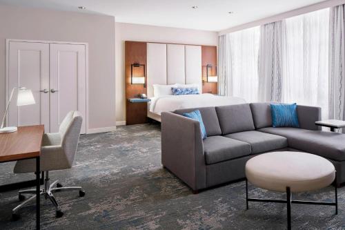 a hotel room with a couch and a bed at Residence Inn by Marriott Washington Downtown/Convention Center in Washington