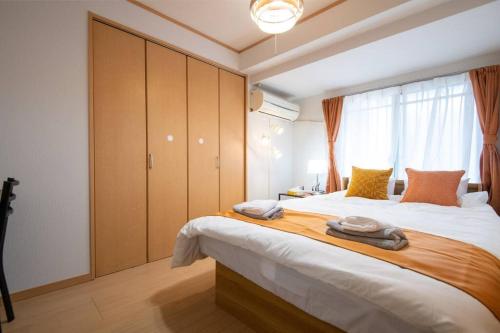 Postel nebo postele na pokoji v ubytování Rea新小岩2丁目403