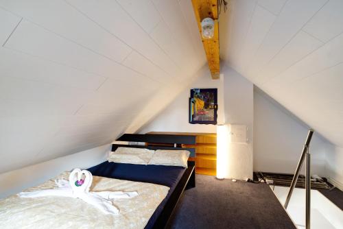 a bedroom with a bed in a attic at Haus Erika Ferienwohnung 2 in Bad Teinach-Zavelstein