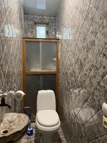 a bathroom with a toilet and a sink at ДАВТЯН ДОМ in Yerevan