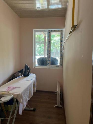 a hospital room with a bed and a window at ДАВТЯН ДОМ in Yerevan