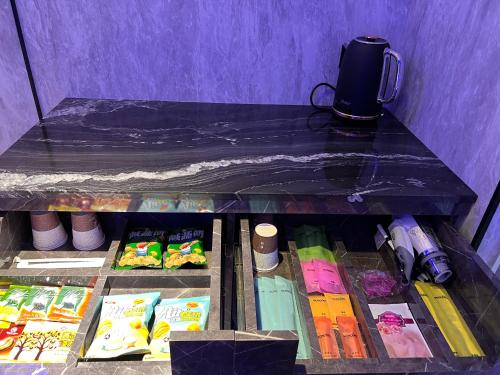 a refrigerator filled with lots of different types of food at MY Motel in Mingjian