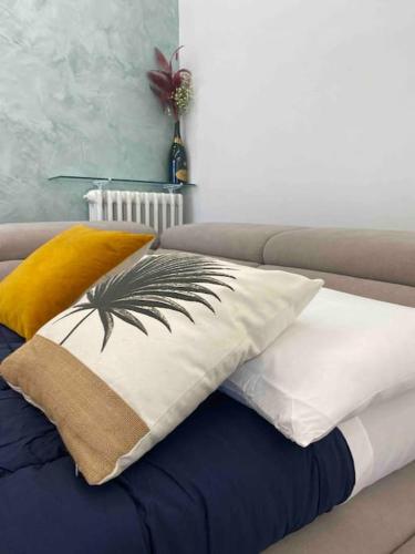 a bed with two pillows on top of it at Luxury Apartment Assisi in Bastia Umbra