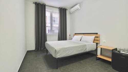 Postel nebo postele na pokoji v ubytování Hostal Lavela