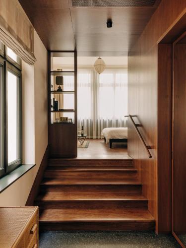 a room with stairs leading to a bedroom at Boutique Hotel Château Royal in Berlin