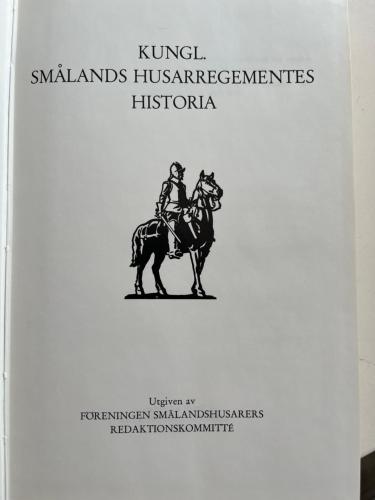 a book with a picture of a man riding a horse at Staby Gårdshotell in Högsby