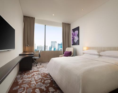 Postel nebo postele na pokoji v ubytování Four Points by Sheraton Jakarta Thamrin