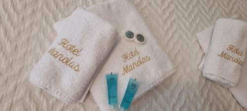 two white towels with the words good morning on them at Manolas in Nei Poroi