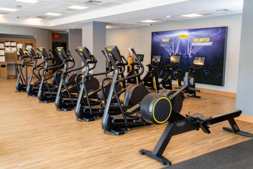 a row of cardio machines in a gym at Sheraton Phoenix Downtown in Phoenix