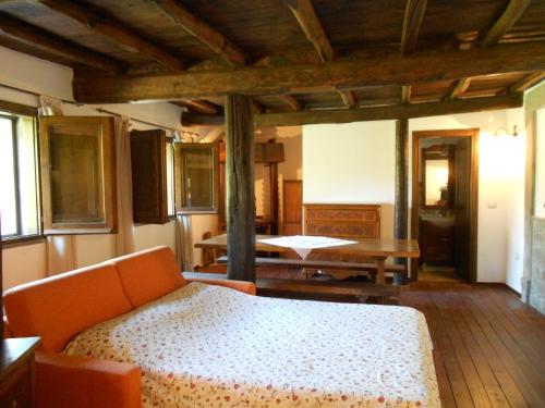 Ein Bett oder Betten in einem Zimmer der Unterkunft La Meridiana Strana