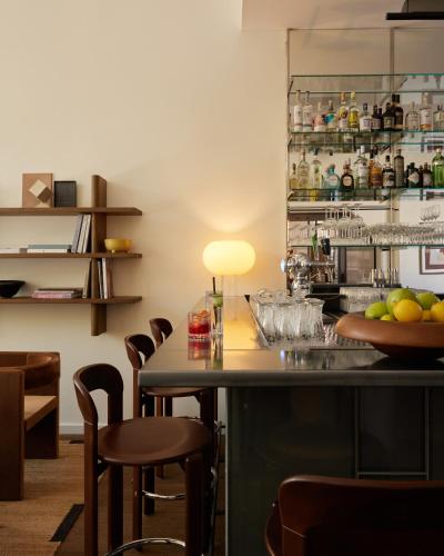 a bar with chairs and a counter in a room at Morgan & Mees Rotterdam in Rotterdam
