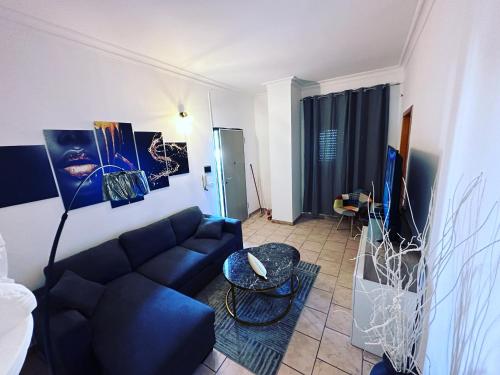 a living room with a couch and a table at La Maison de Marianne in Trepuzzi